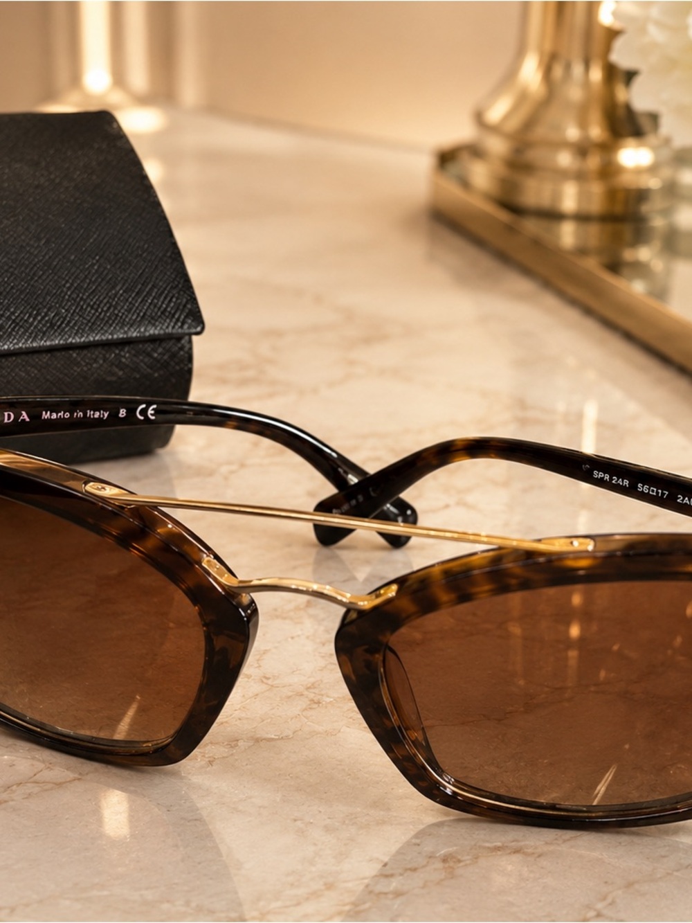 Prada Tortoiseshell Sunglasses with Gold Accents